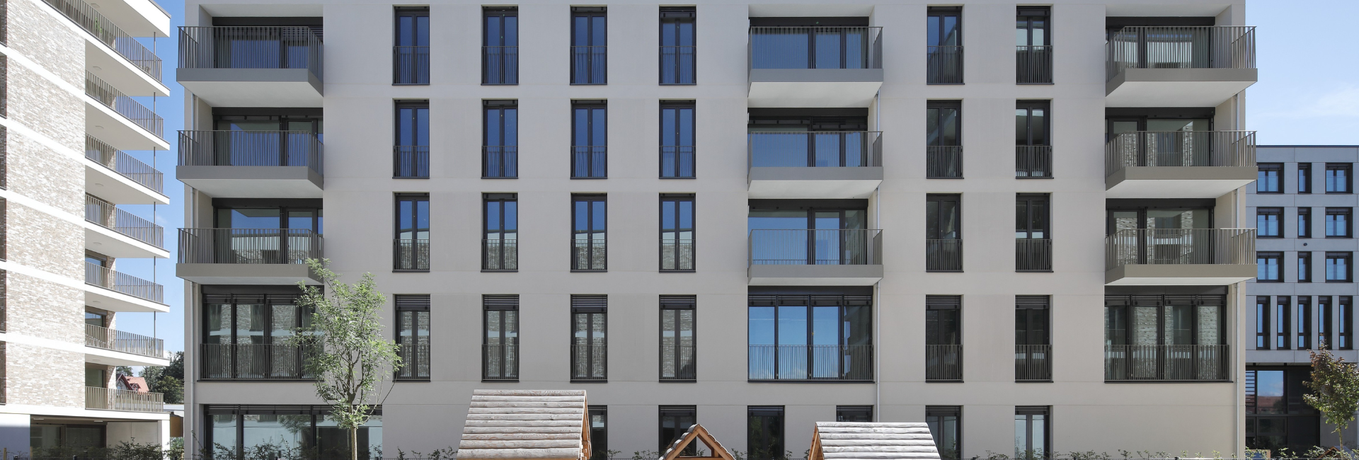 Vierlinden-Quartier in Lindau mit Massivbau, Betonrohbau, grünen Höfen und Erdwärmeversorgung